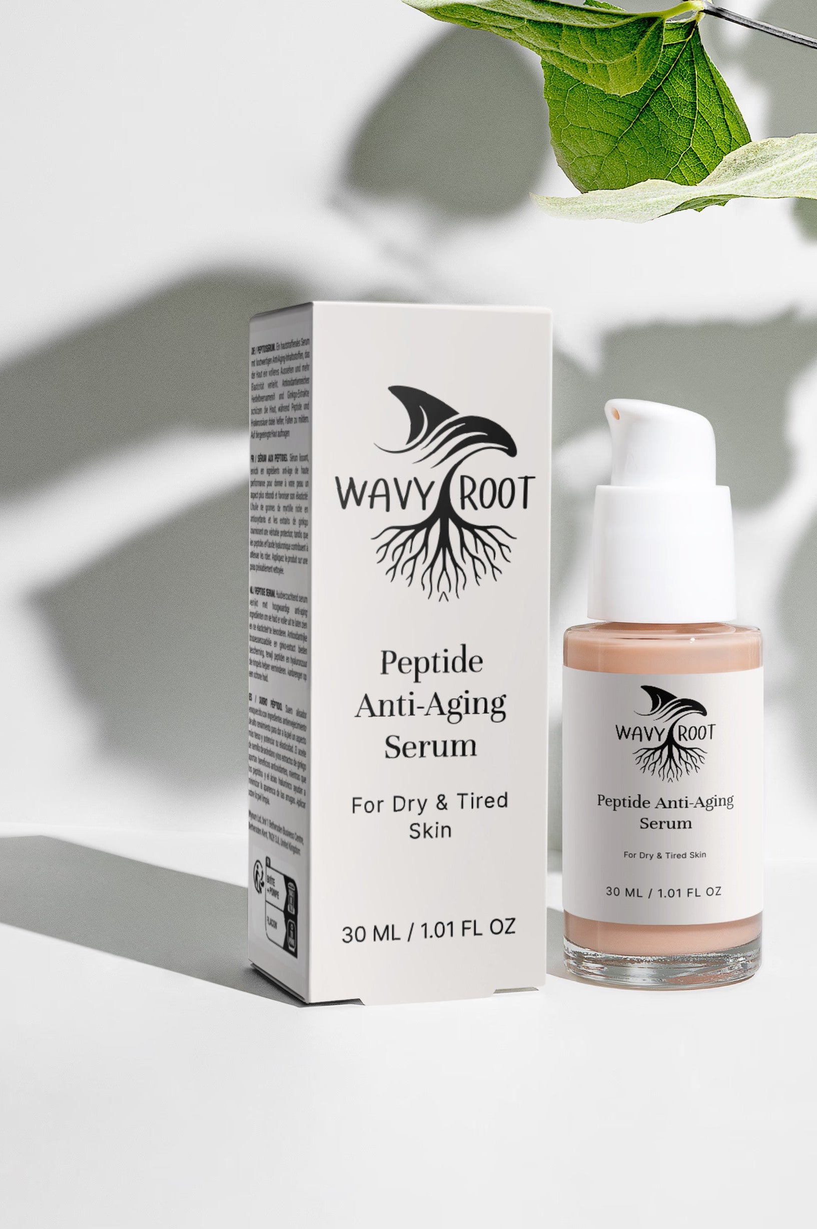 Wavy Root Peptide Anti-Aging Serum shown with its white packaging box and clear bottle containing a light peach-toned serum, styled with green leaves and shadows on a white background.